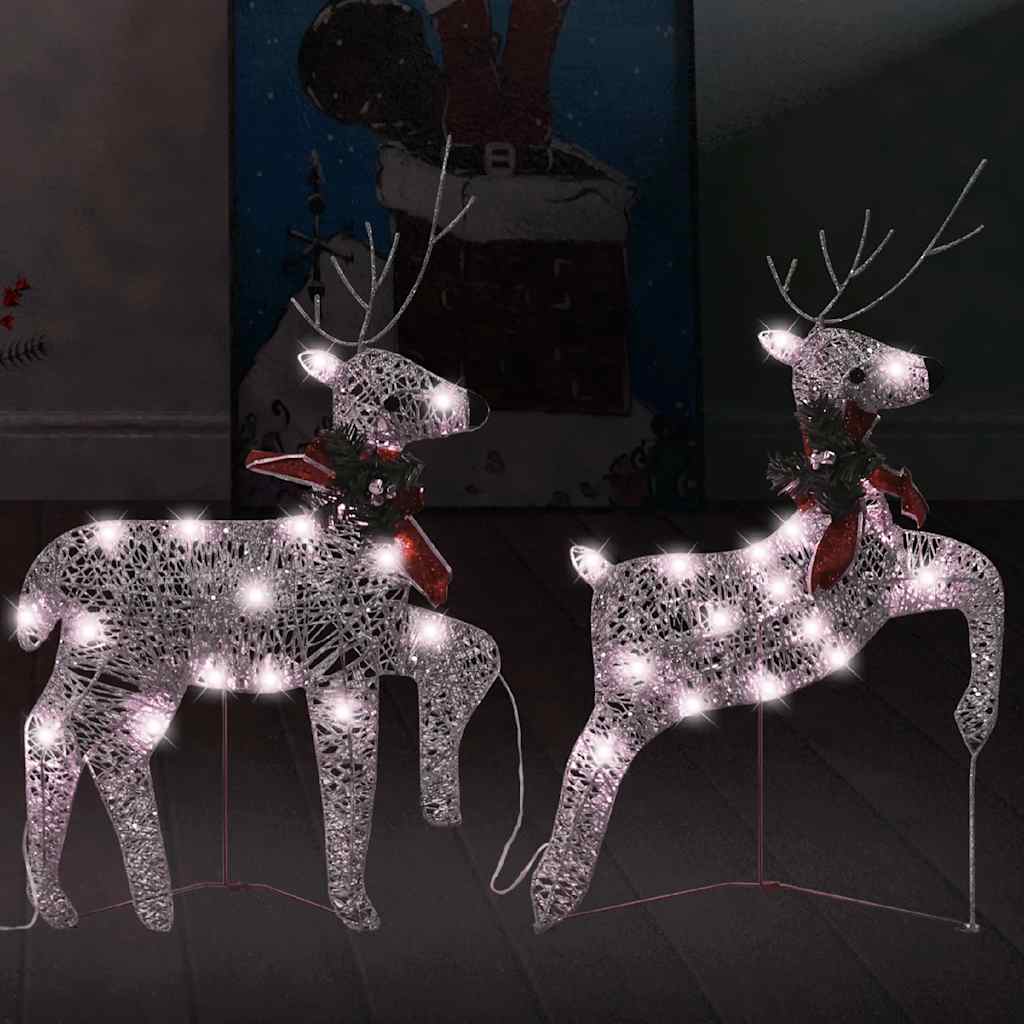 Pair of gold light-up Christmas reindeer statues with 40 warm white LEDs and red bows.