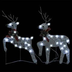 Two silver light-up reindeer with 40 LEDs and red bows on black background.