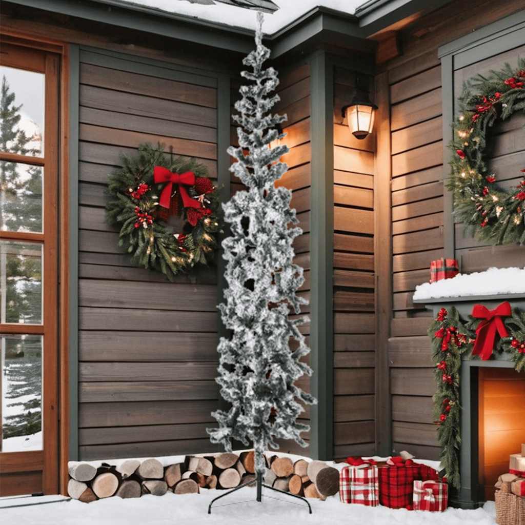 A 7 ft slim half Christmas tree with flocked snow effect, green PVC branches, and steel stand against a wooden wall.