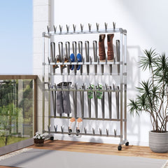 Silver aluminum shoe rack on wheels, holding shoes and boots in a modern entryway.