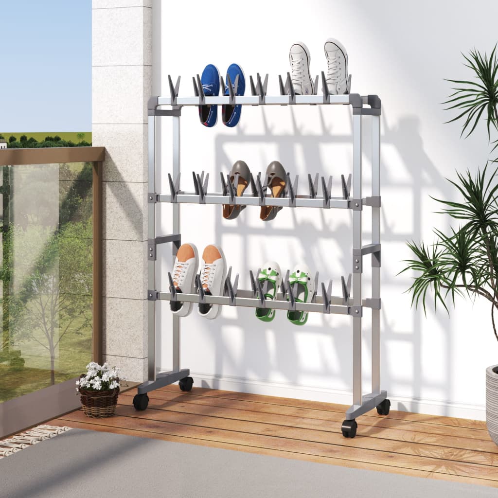 Silver aluminum shoe rack with wheels holding multiple pairs of shoes in a compact space