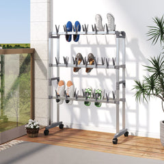 Silver aluminum shoe rack with wheels holding multiple pairs of shoes in a compact space