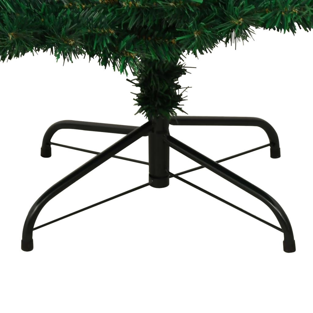 5ft pre-lit green PVC Christmas tree with swirl design and black metal stand.