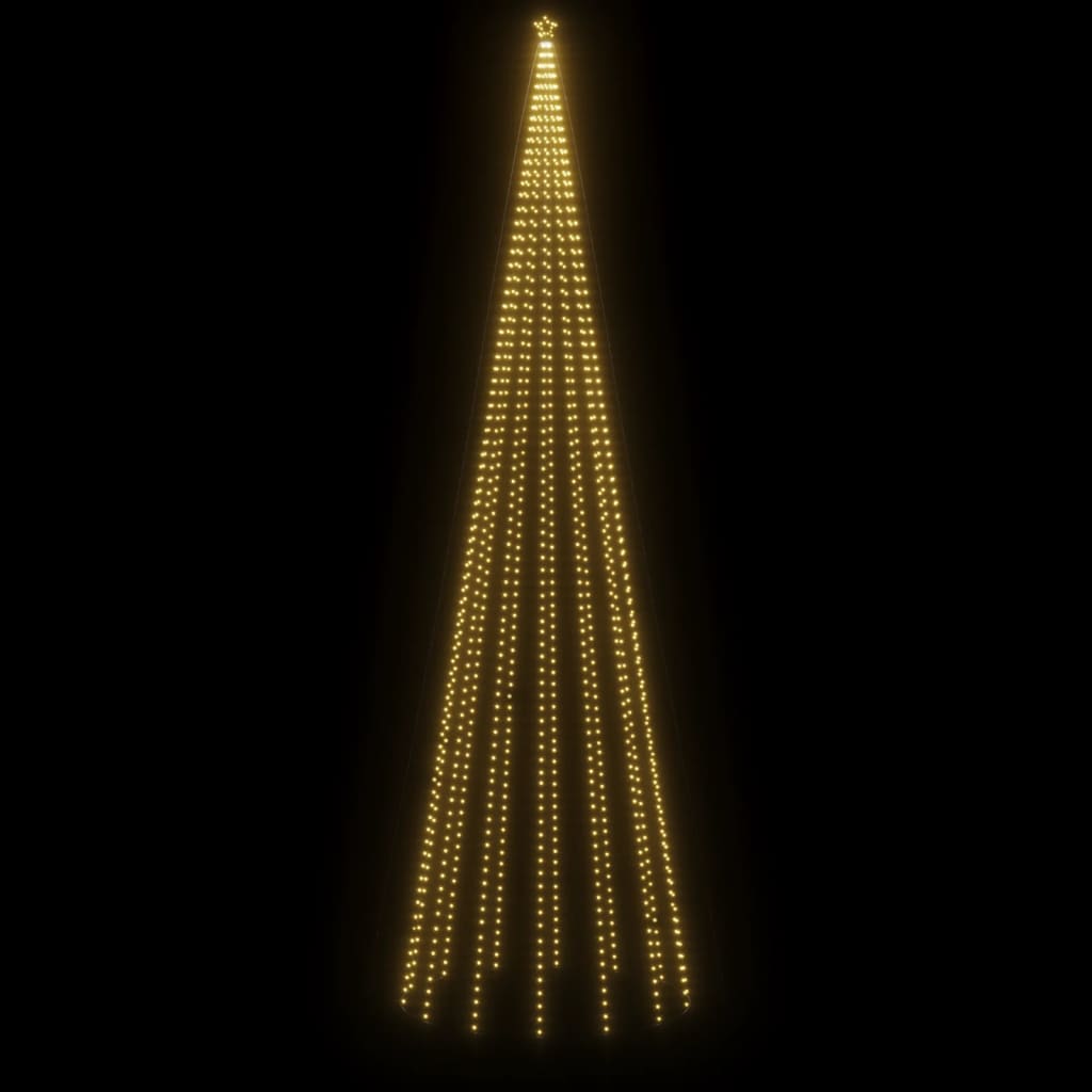 A 26ft tall Christmas cone tree with 1134 warm white LEDs on a black background.