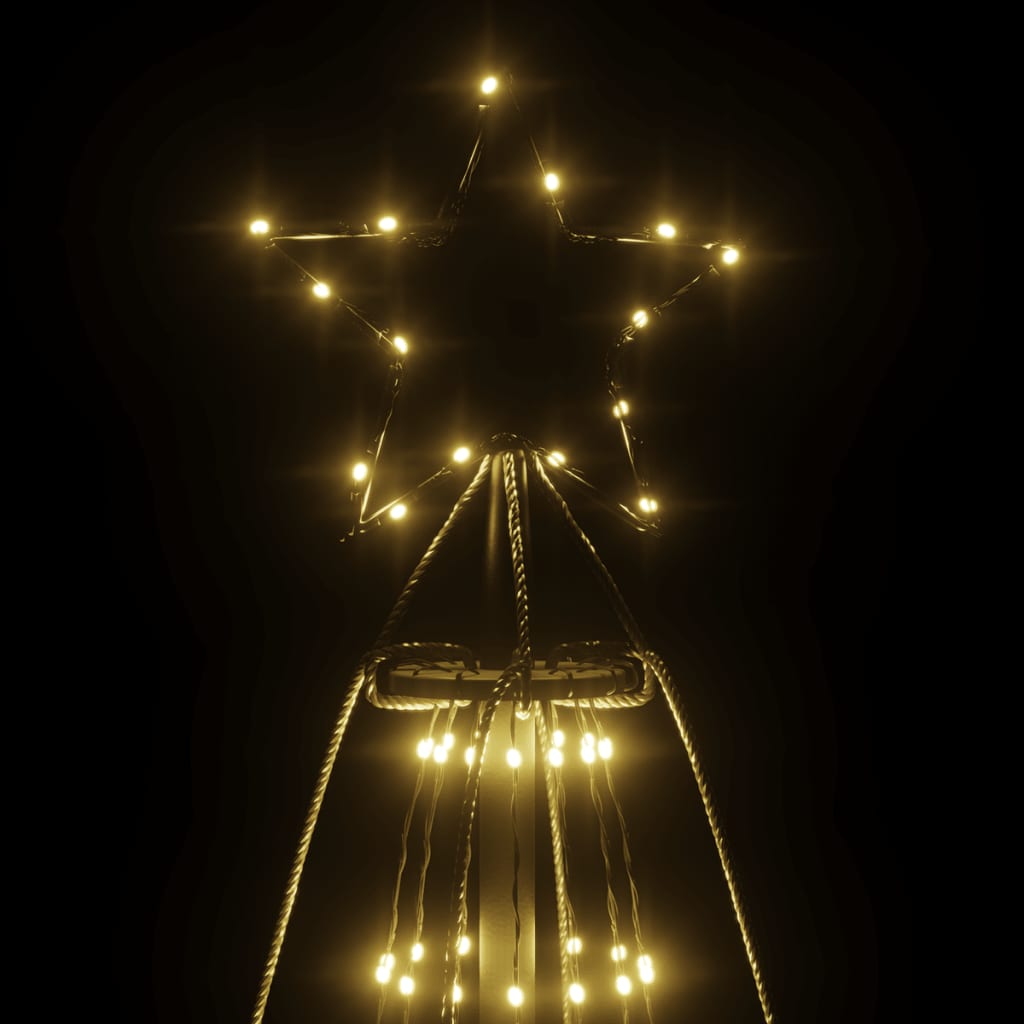 A 26ft tall Christmas cone tree with 1134 warm white LEDs forming a glowing, illuminated structure on a dark background.
