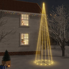 A 26ft Christmas cone tree with 1134 warm white LEDs stands in a snowy yard.