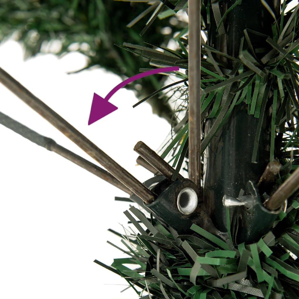 Close-up of a snow-flocked artificial Christmas tree base with a purple arrow indicating assembly.
