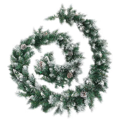 A long, green Christmas garland with flocked tips and pine cones is coiled on a white background.