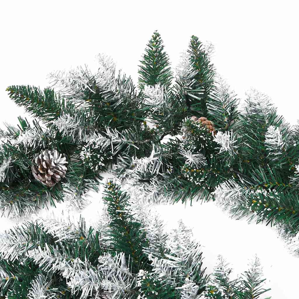9 ft green PVC Christmas garland with flocked snow, pine cones, and warm white LED lights.