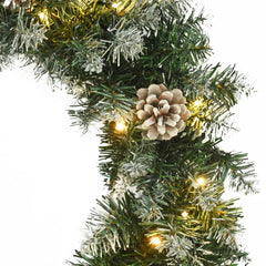 17.7-inch green PVC Christmas wreath with LED lights, pine cones, and artificial snow.