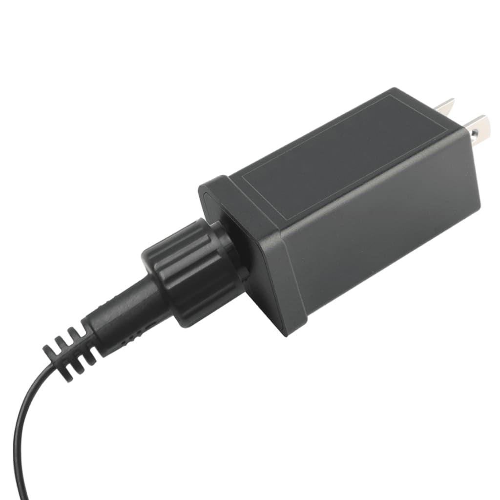 Black power adapter with plug and connected cord on white background.