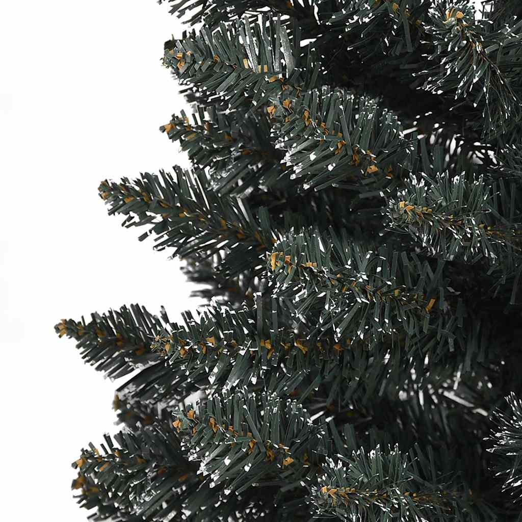 A 6 ft slim artificial Christmas tree in green PVC with snow-dusted tips.