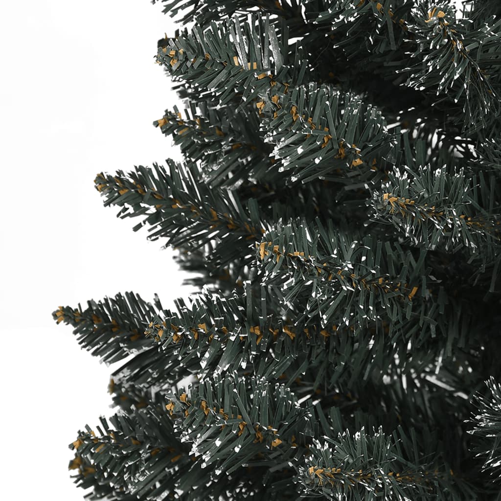 7ft slim artificial Christmas tree in green PVC with artificial snow dusting.