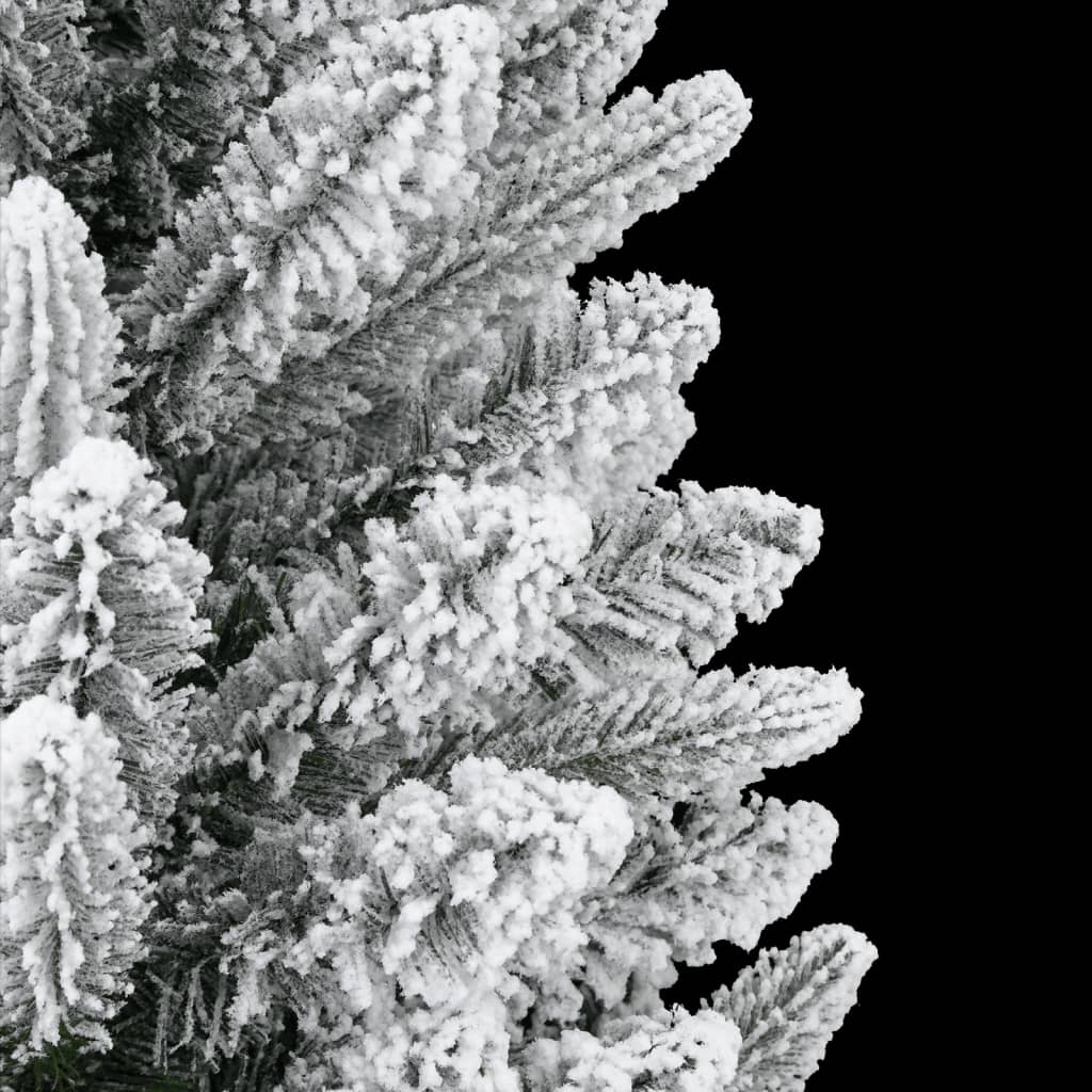 A 5ft artificial Christmas tree with white flocked snow on PVC and PE branches.