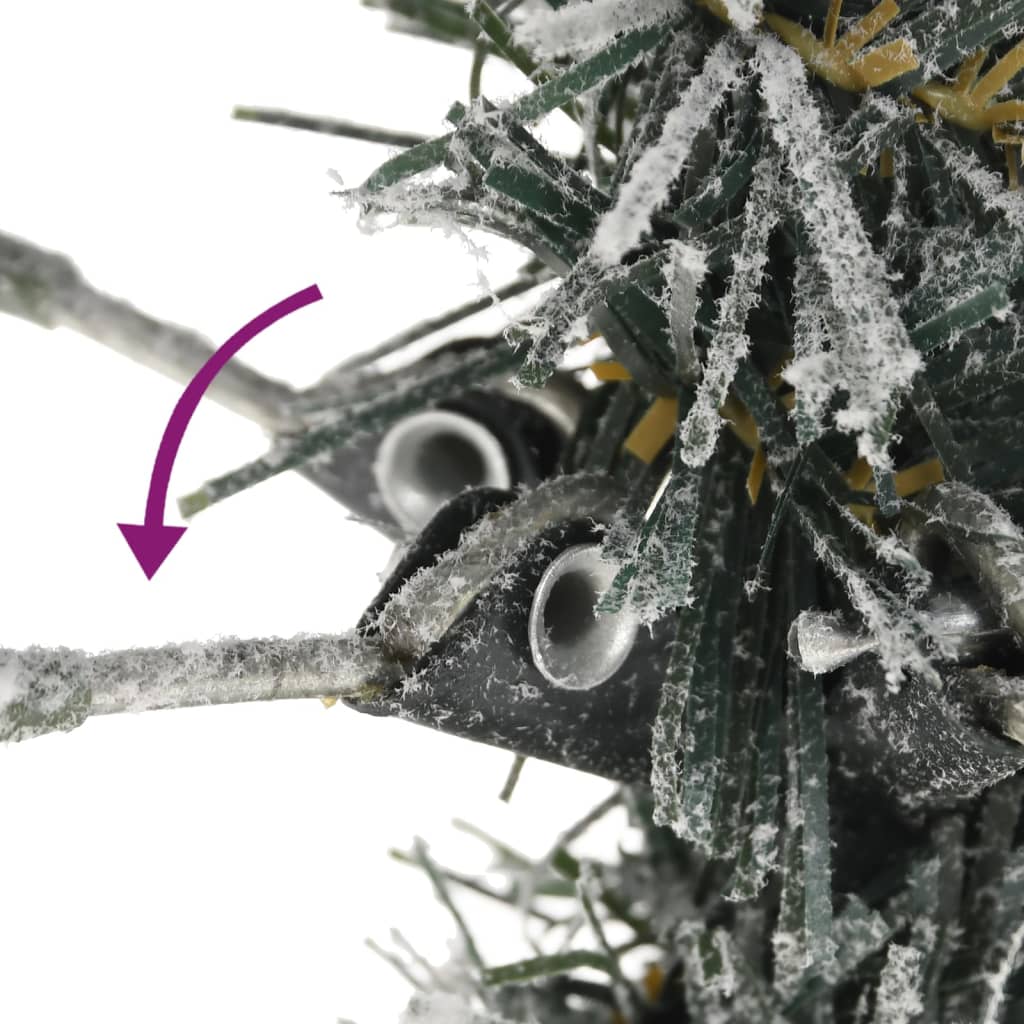 Close-up of flocked snow-covered branches on a slim 7ft artificial Christmas tree.