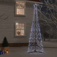 A 10-foot tall outdoor Christmas cone tree with 500 cold white LEDs, lit up at night beside a snowy house.