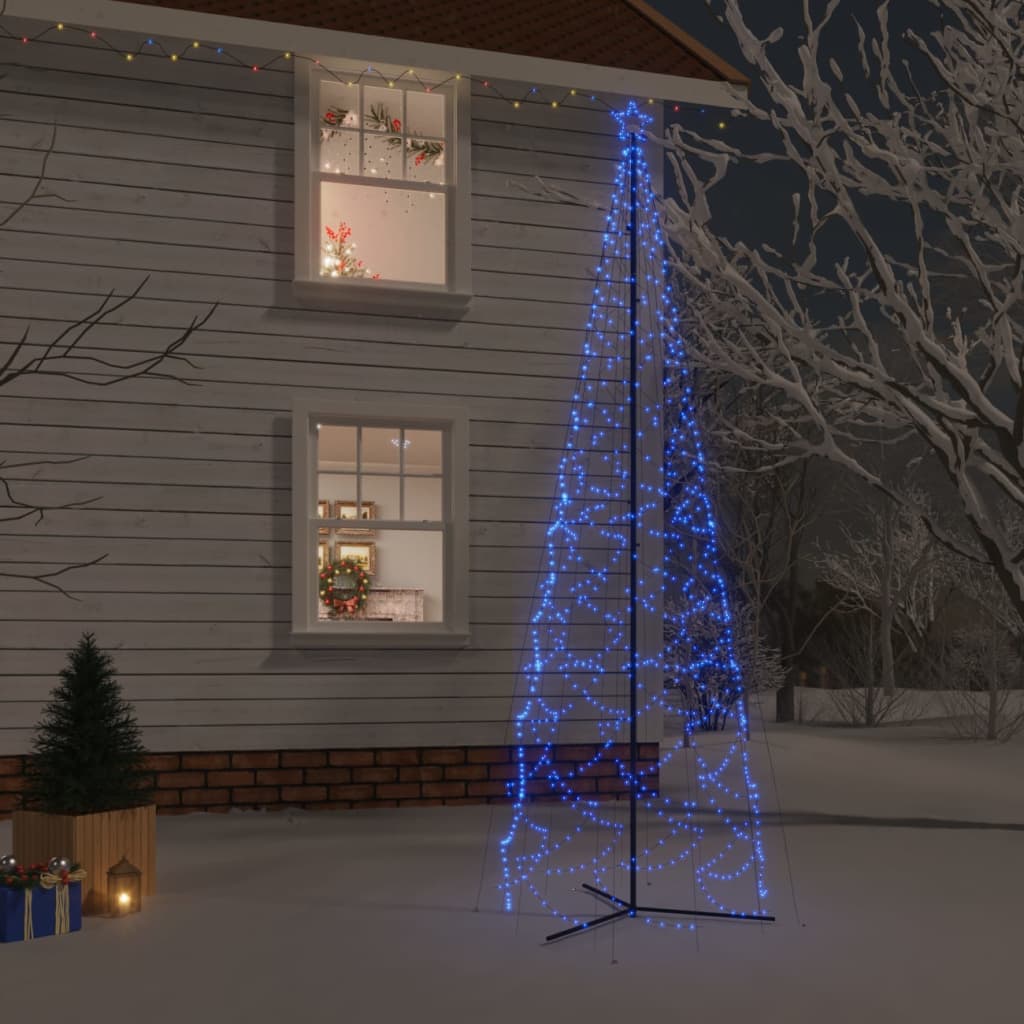 A blue LED Christmas cone tree with 1400 lights, standing 5x16 ft tall in a snowy outdoor scene.