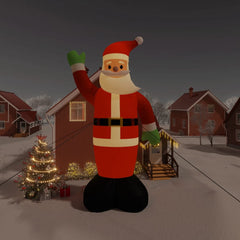 12ft inflatable Santa Claus with LEDs waving in snowy yard with houses and trees.
