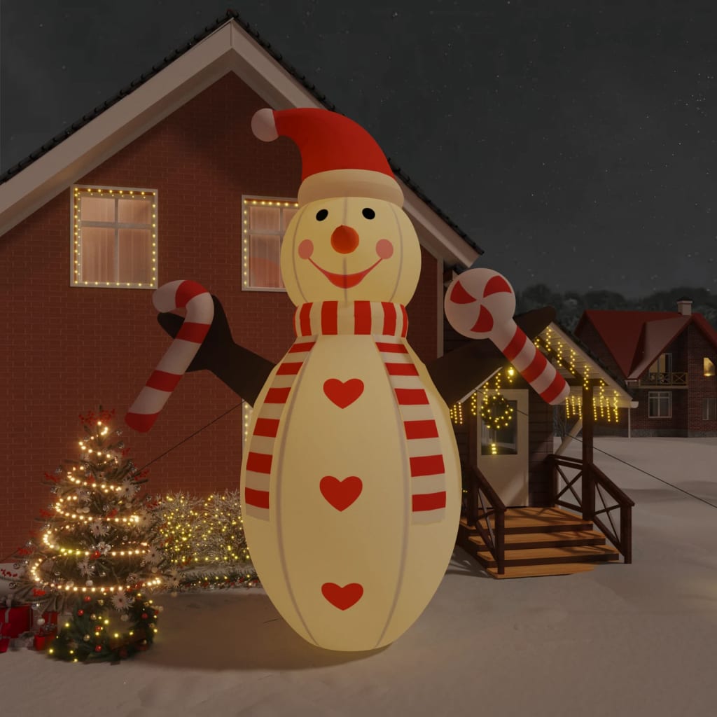 8ft inflatable LED snowman in multicolor Oxford fabric, wearing a red hat and scarf, standing in snowy yard with candy canes.