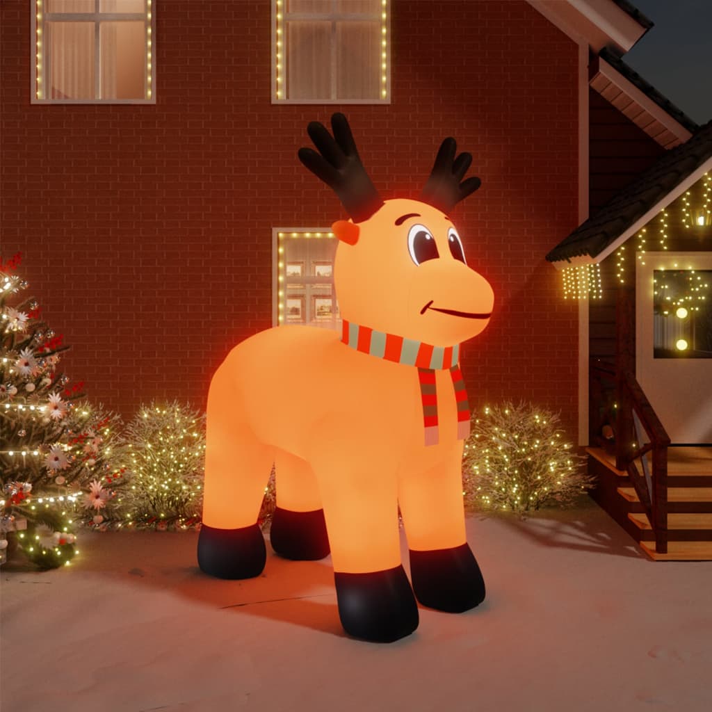 A 157.5-inch tall inflatable LED reindeer in orange with black antlers, scarf, and glowing lights stands in a snowy yard.