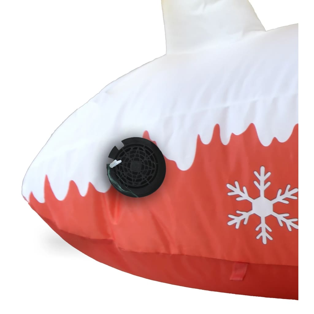 Close-up of inflatable Santa and reindeer decoration with multicolor LED lights and snowflake design
