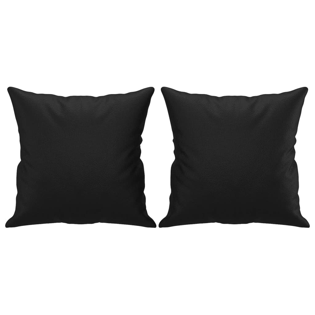 Two black faux leather throw pillows are displayed against a white background.