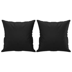 Two black faux leather throw pillows are displayed against a white background.