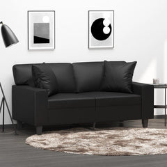 Two black faux leather throw pillows, 15.7x15.7 inches, on a black leather sofa.