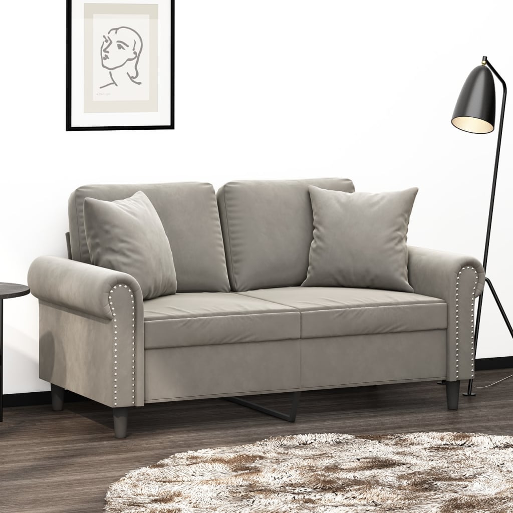 Set of two light gray velvet throw pillows, each 15.7 inches square.