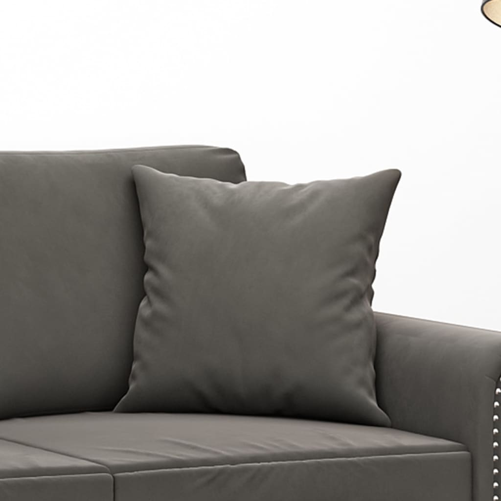 Two dark gray velvet throw pillows, each 15.7 inches square, on a gray sofa.