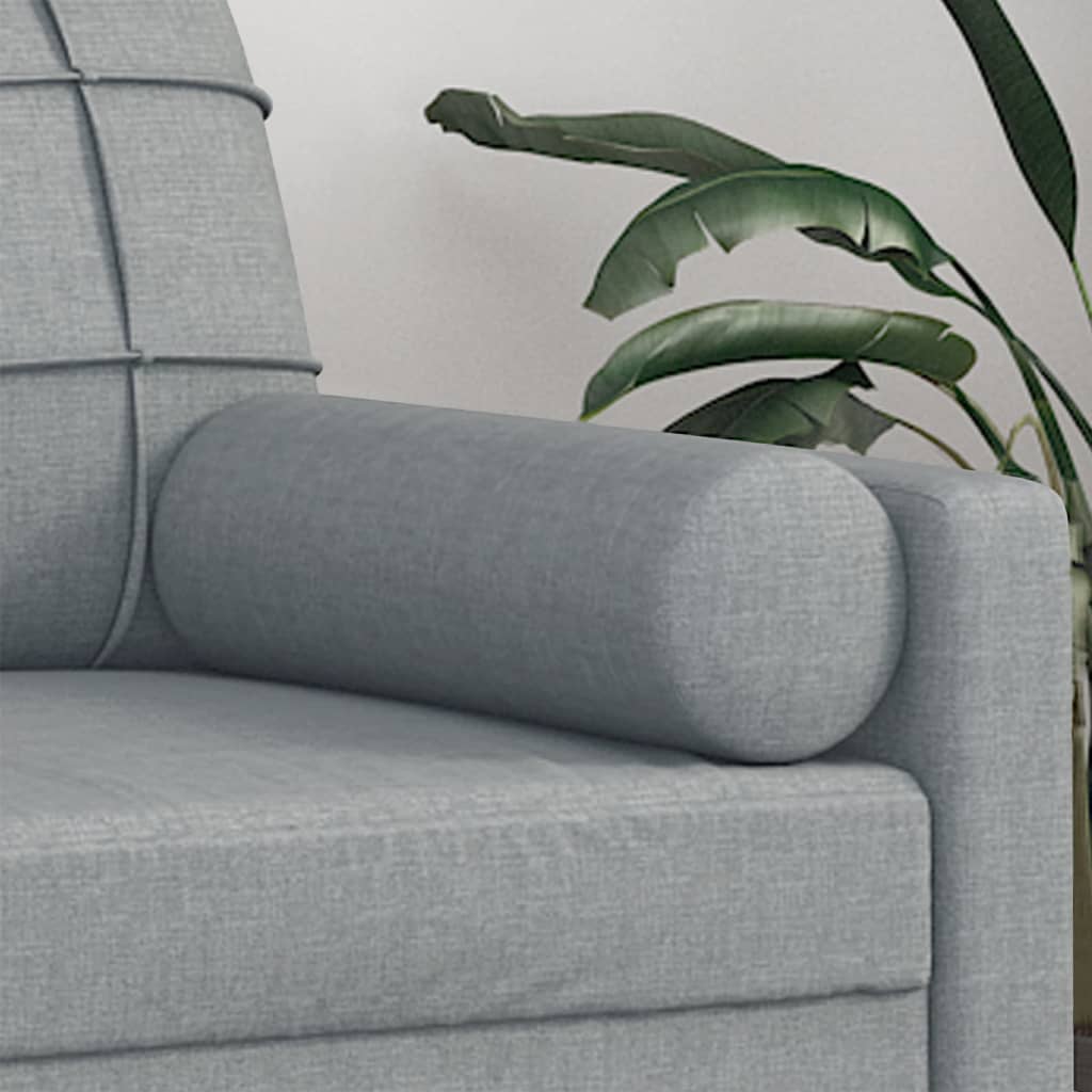 Two light gray fabric bolster throw pillows, each 5.9 by 19.7 inches, on a sofa.