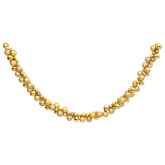 Gold polystyrene Christmas ball garland with mixed sizes, 68.9 inches long.