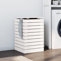 White solid pine wood laundry basket with lid and slats, next to a washing machine.