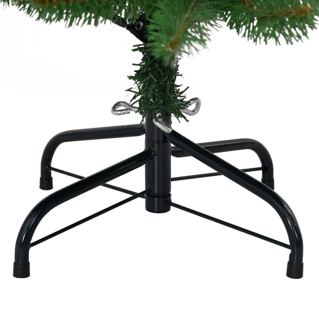 The base of a green artificial Christmas tree with a black metal stand.