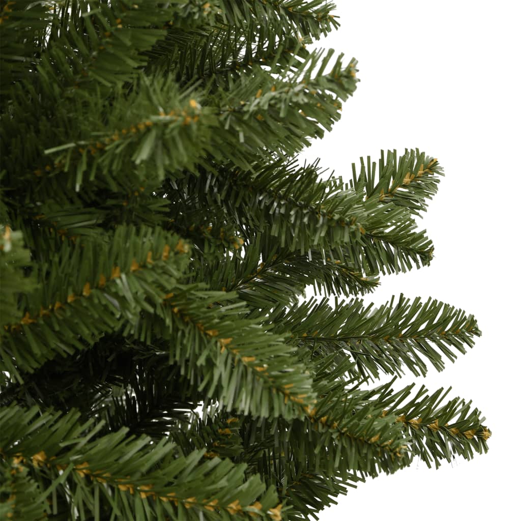 Green hinged artificial Christmas tree with lifelike branches and a sturdy metal stand.