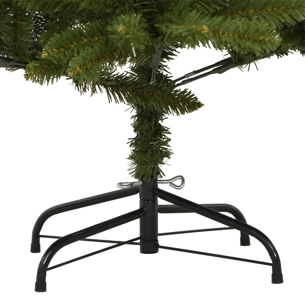 Green hinged artificial Christmas tree with lifelike branches and a sturdy metal stand.