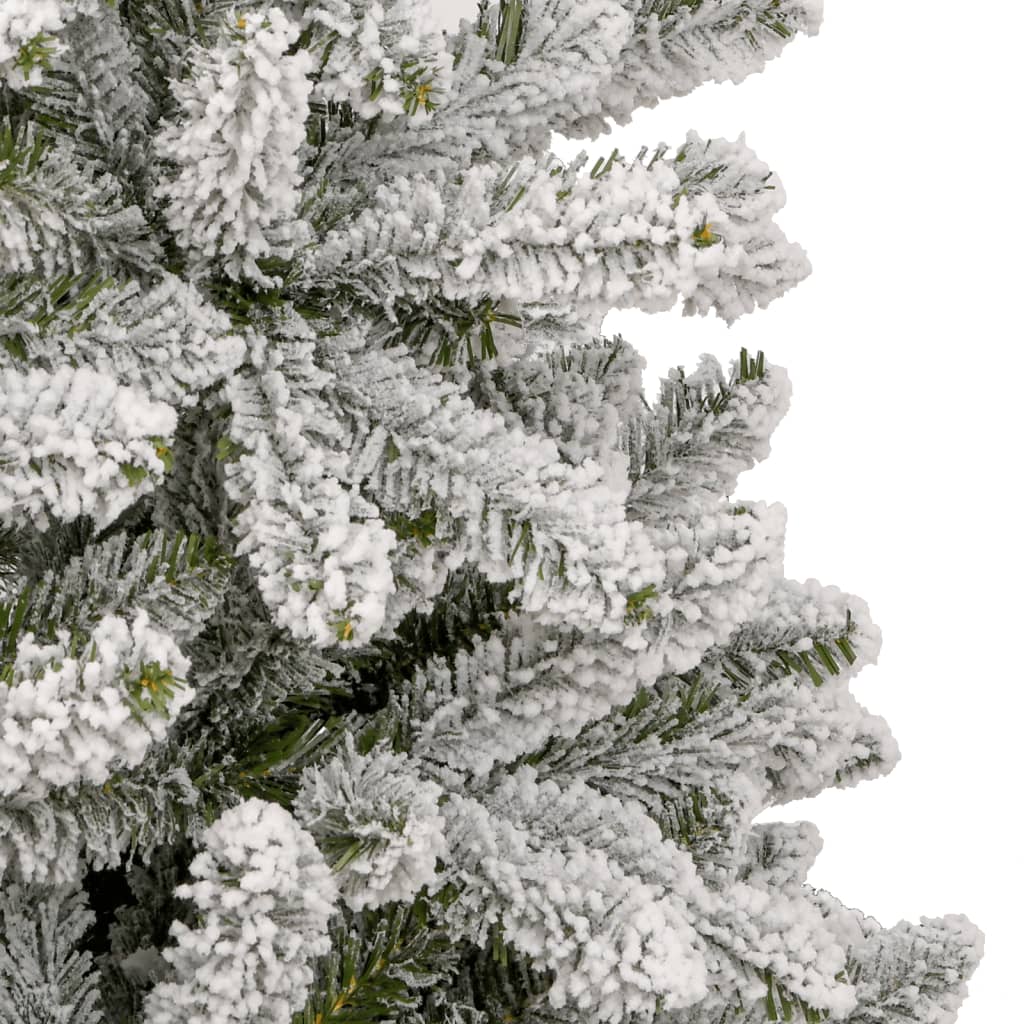 A 7ft artificial Christmas tree with hinged branches and flocked snow effect.