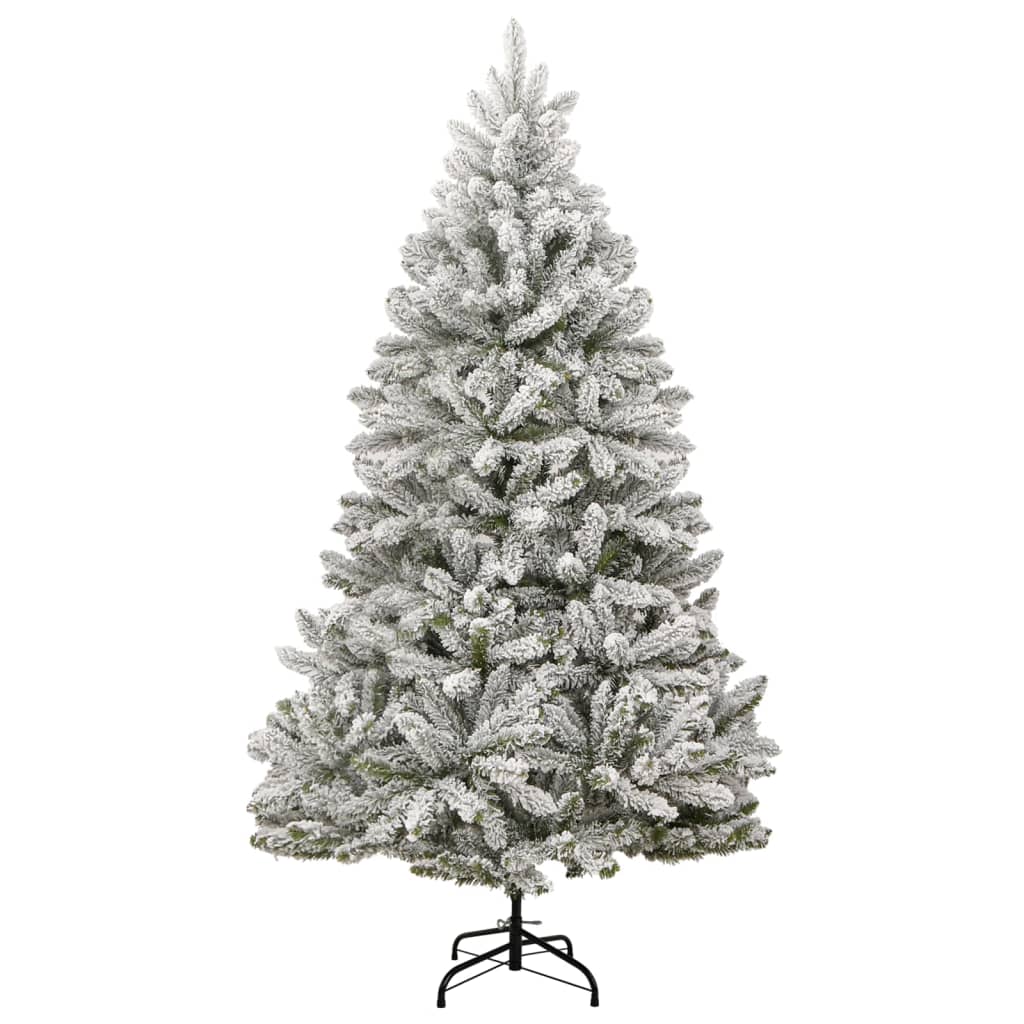 Tall artificial Christmas tree with flocked snow-covered branches and metal stand.