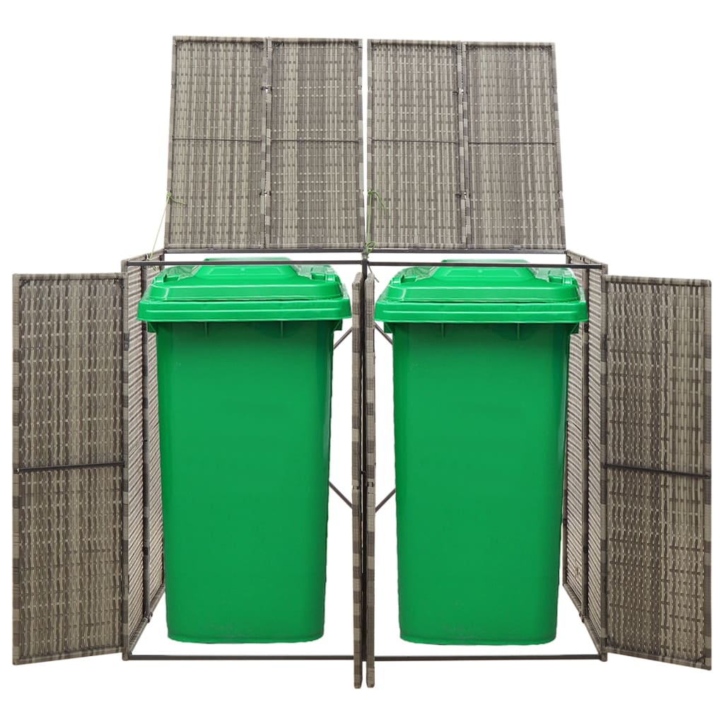 A gray poly rattan double wheelie bin shed with two green bins inside.