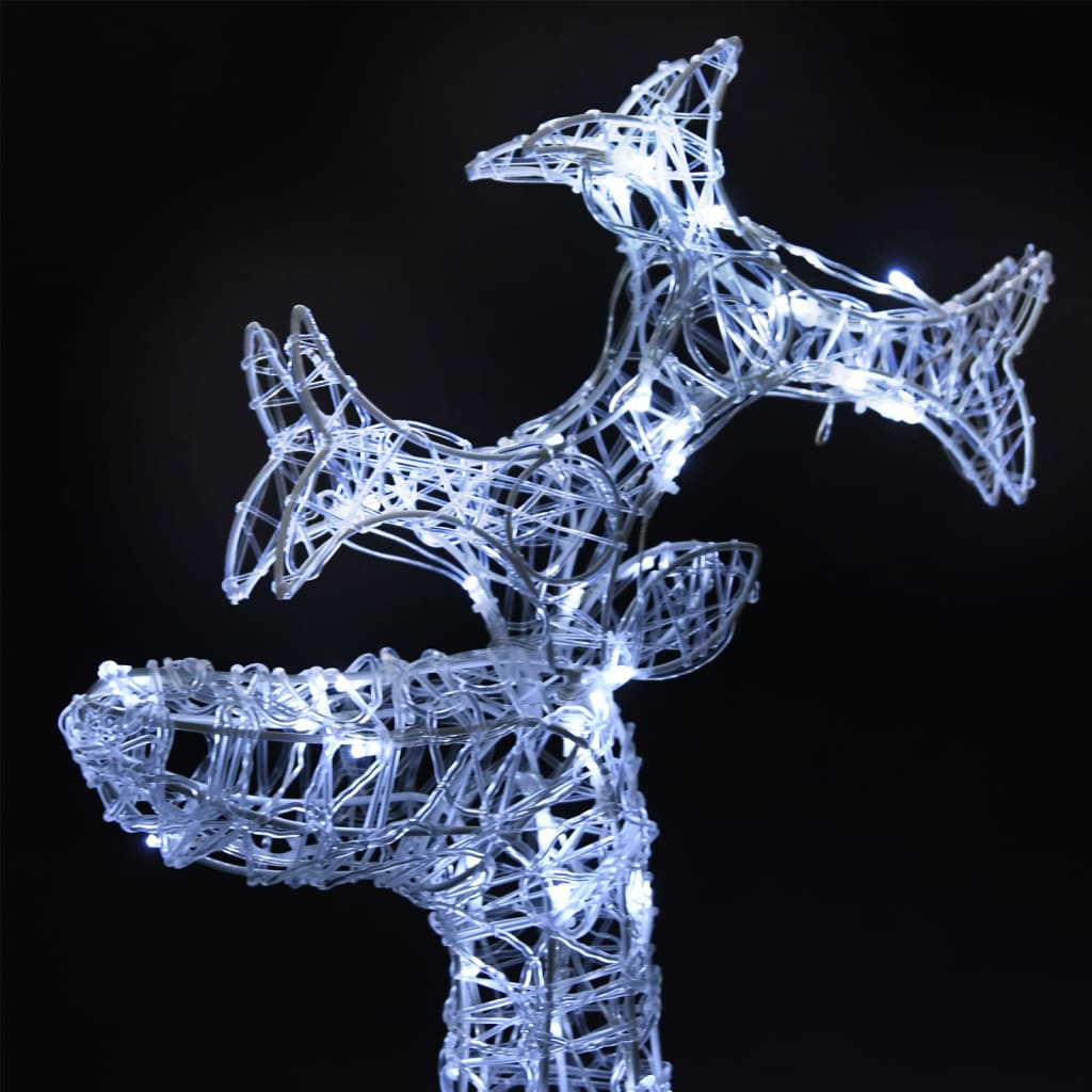Three white acrylic LED reindeer Christmas decorations with wireframe design and glowing lights.