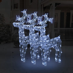 Three white LED-lit acrylic reindeer figures standing together for Christmas decor.