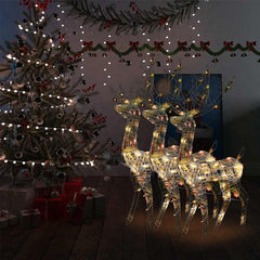 Three clear acrylic reindeer figures with multicolor LED lights, shown lit in a Christmas setting.