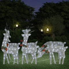 Six silver mesh reindeer figures with cold white LED lights in a garden scene.