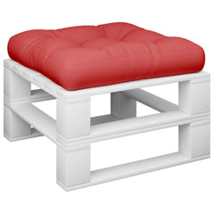 A red tufted cushion rests on a white wooden pallet base.