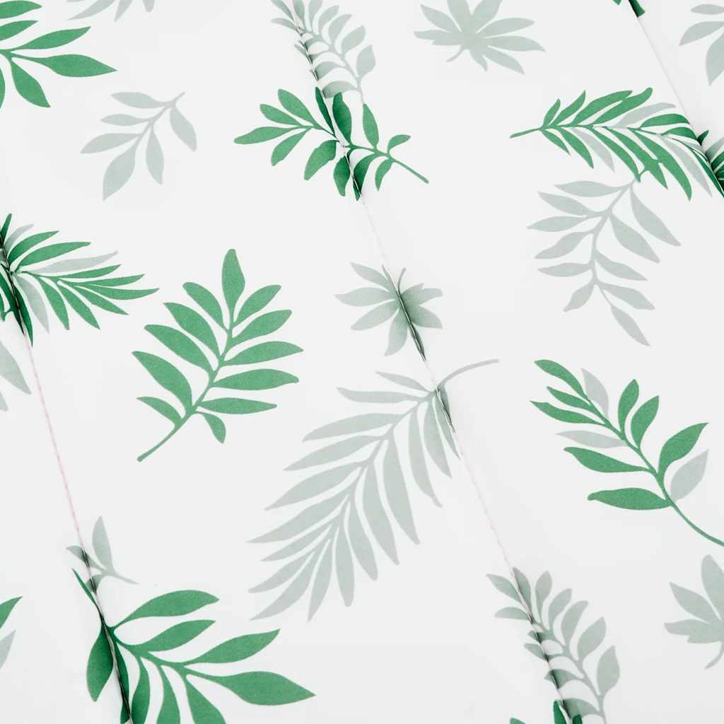 White sun lounger cushion with green leaf pattern made of Oxford fabric and foam filling.