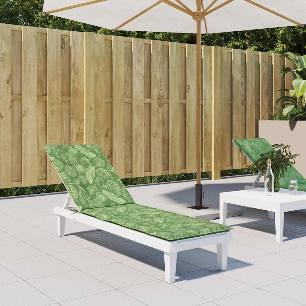 Green leaf-patterned Oxford fabric deck chair cushion on a white lounger.