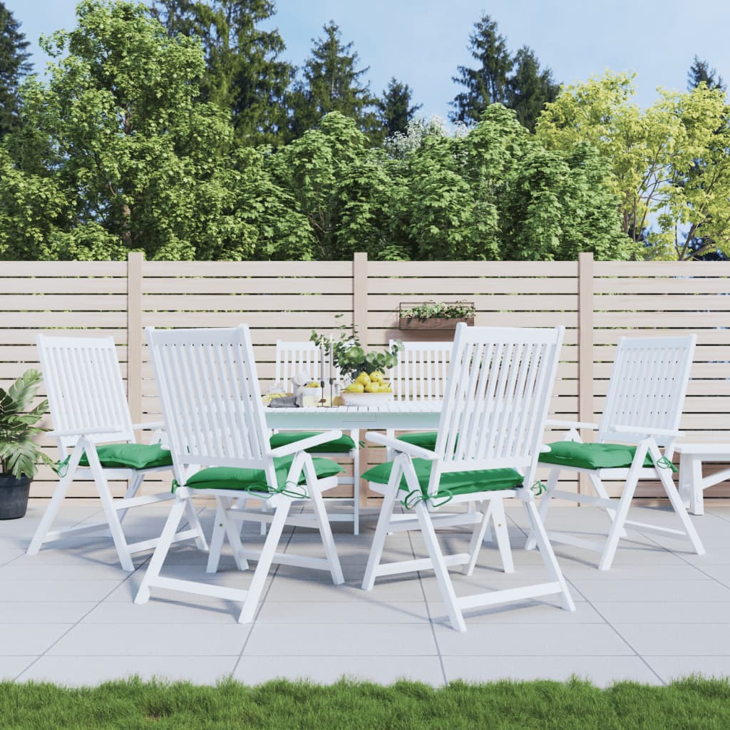 Six green Oxford fabric chair cushions, 15.7x15.7x2.8in, on white patio chairs around a table.