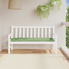Green leaf-patterned bench cushion on white outdoor bench with cushions and plants.