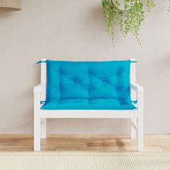 A pair of light blue Oxford fabric cushions with tufted padding and ties for a garden bench.