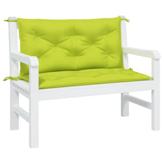 Two bright green Oxford fabric cushions for a garden bench, with ties and tufted padding.